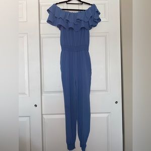 Blue jumpsuit size medium with ruffle collar elastic waistband new never worn